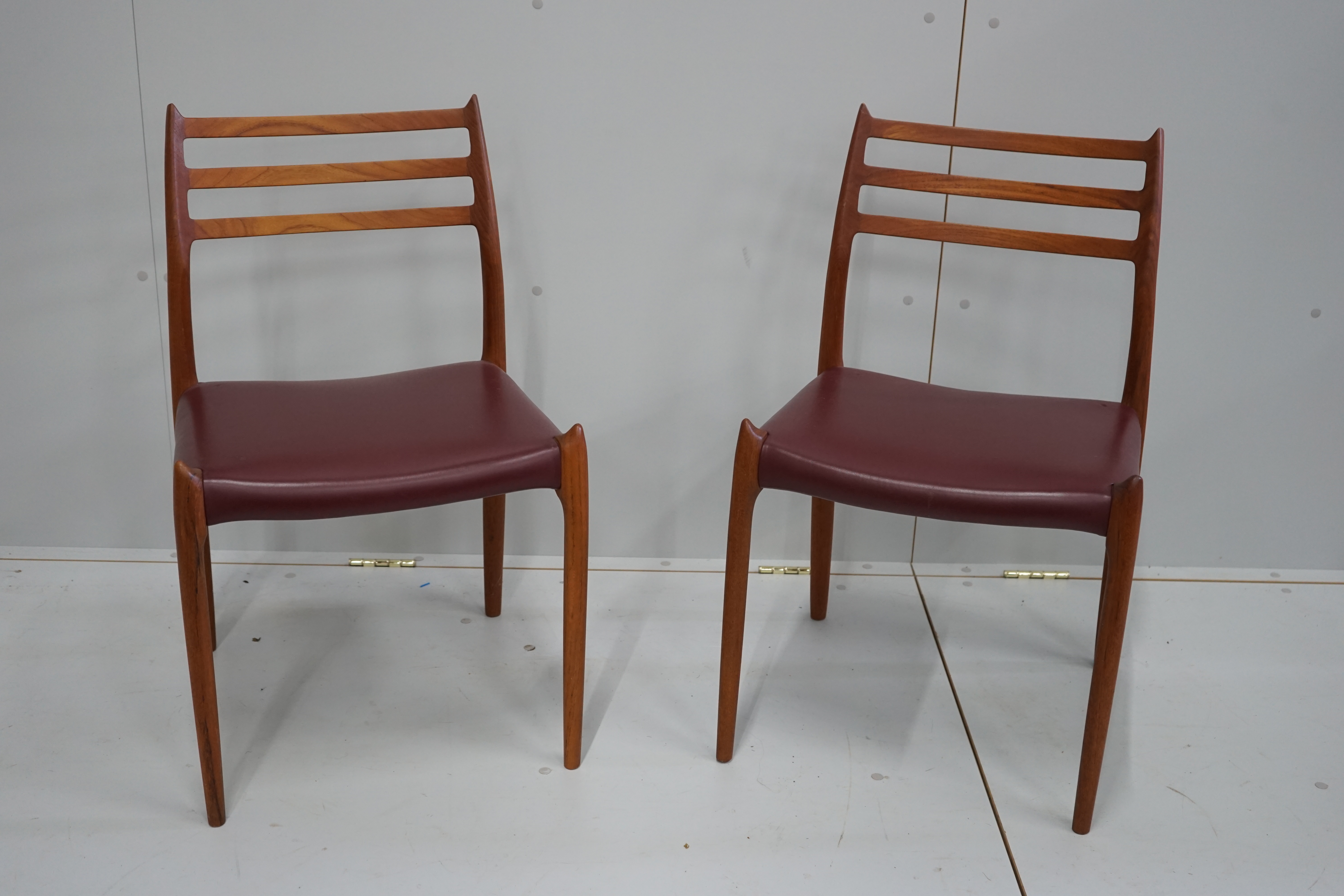 Niels Otto Moller for J.L Mollers a set of eight model 78 Danish teak dining chairs circa 2012, width 49cm, depth 43cm, height 81cm all with 50 year anniversary and manufacturer marks to seat rails